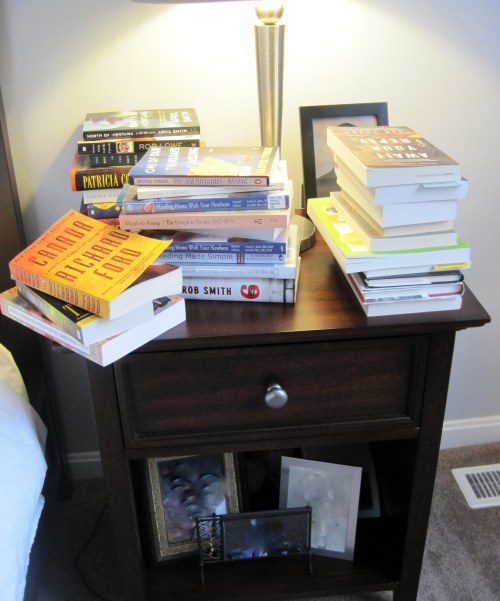 You can't even see the pictures on the nightstand, there are so many books in the way.